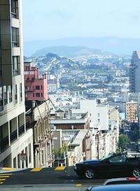 Buildings in city against sky