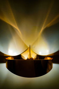 Low angle view of illuminated tent against sky