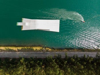 Aerial view of road sign by sea