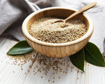 White quinoa seeds on a old wooden background