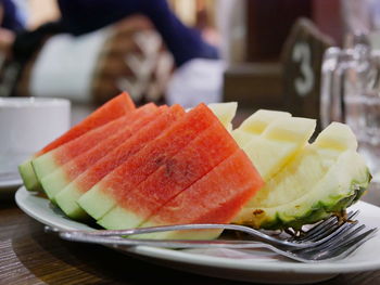 Slices of juicy and tasty watermelon and pineapple served during a khantok dinner 