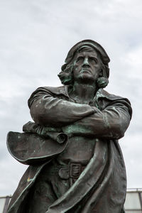 Low angle view of statue against sky