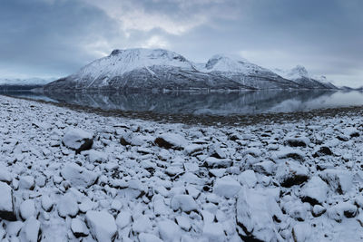 Scenic view of snowcapped mountains against sky during winter