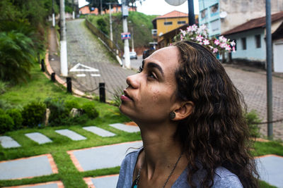 Profile view of woman standing on street