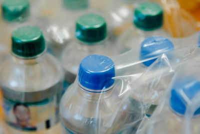 Close-up of drinking bottles