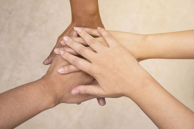 Midsection of woman touching hand