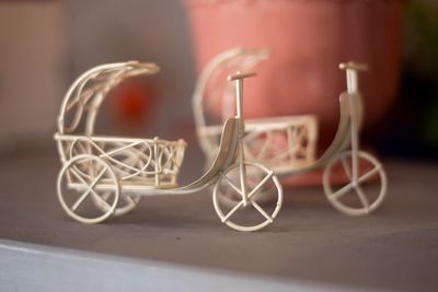 Close-up of objects on table against wall