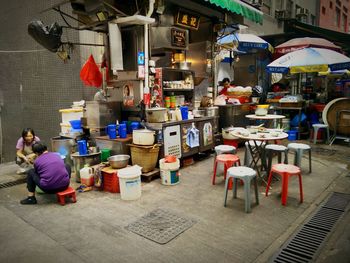 Rear view of people at market stall in city