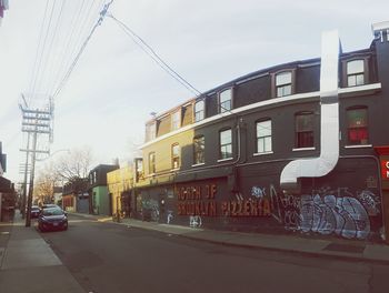 View of buildings in city against sky