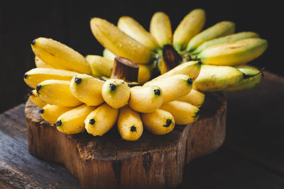 Close-up of wet bananas on wooden table