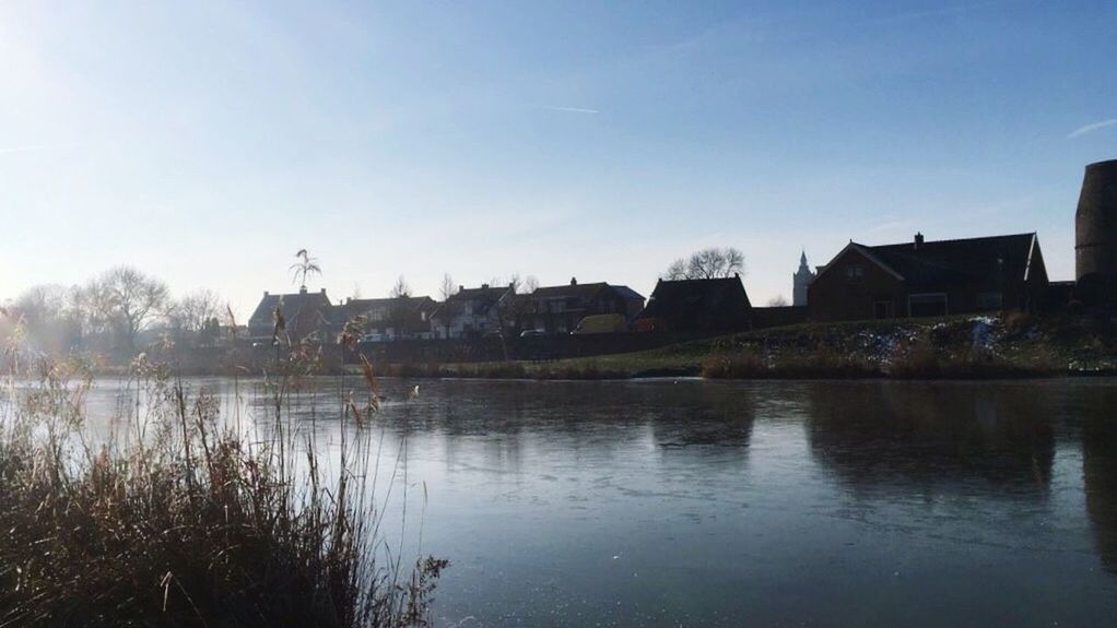 water, built structure, architecture, building exterior, reflection, tree, sky, river, no people, outdoors, nature, day