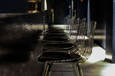 Empty chairs arranged in row