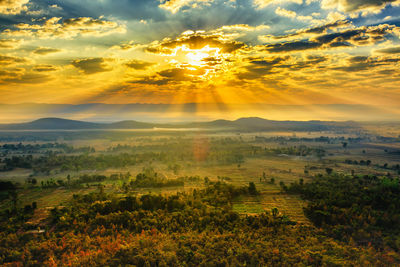 Sunset / sunrise with clouds, light rays and other atmospheric effect