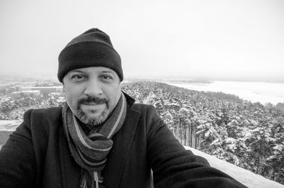 Portrait of man standing against sea