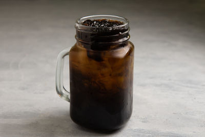 Close-up of drink in jar on table