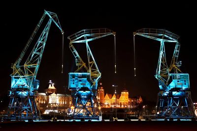 Illuminated ferris wheel at night