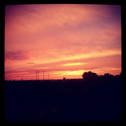 Scenic view of landscape against sky at sunset