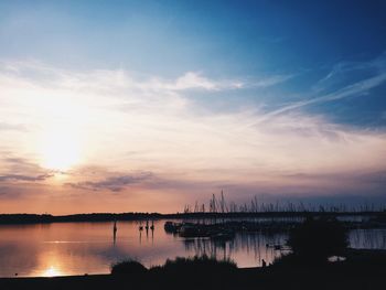 Silhouette of marina at sunset