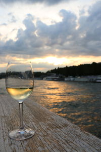 Close-up of wineglass on wooden table