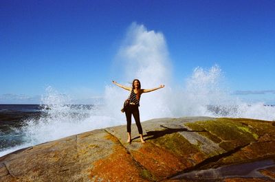 Woman enjoying at the coast