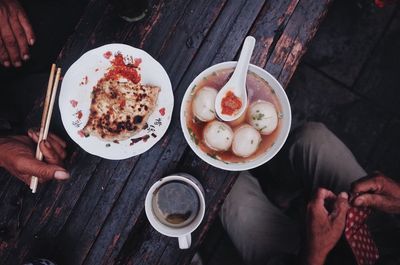 High angle view of man preparing food on table