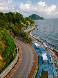 High angle view of road by sea against sky