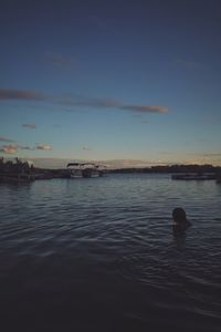 Scenic view of calm sea against cloudy sky