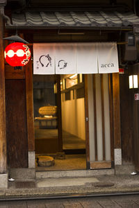 Illuminated sign on street in city