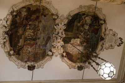 Close-up of chandelier hanging on wall