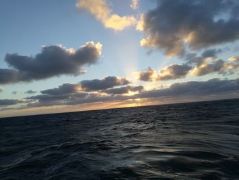 Scenic view of sea against sky at sunset