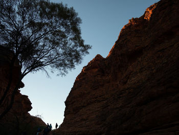 Low angle view of rock formation against sky