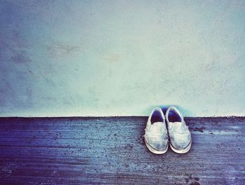 High angle view of shoes on beach