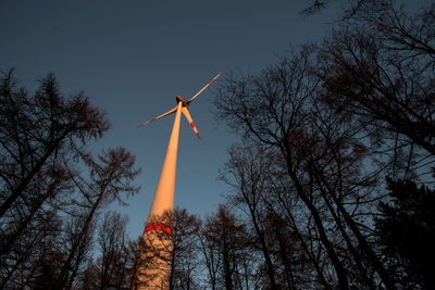 Low angle view of windmill against sky