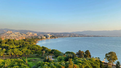 Scenic view of sea and buildings against sky