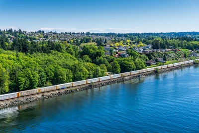 Train on tracks and water in tacoma, washington.