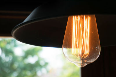 Close-up of illuminated light bulb