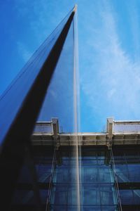 Low angle view of building against blue sky