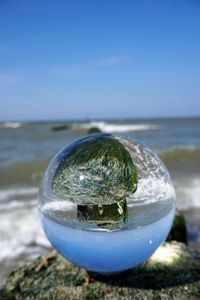 Close-up of blue sea against clear sky