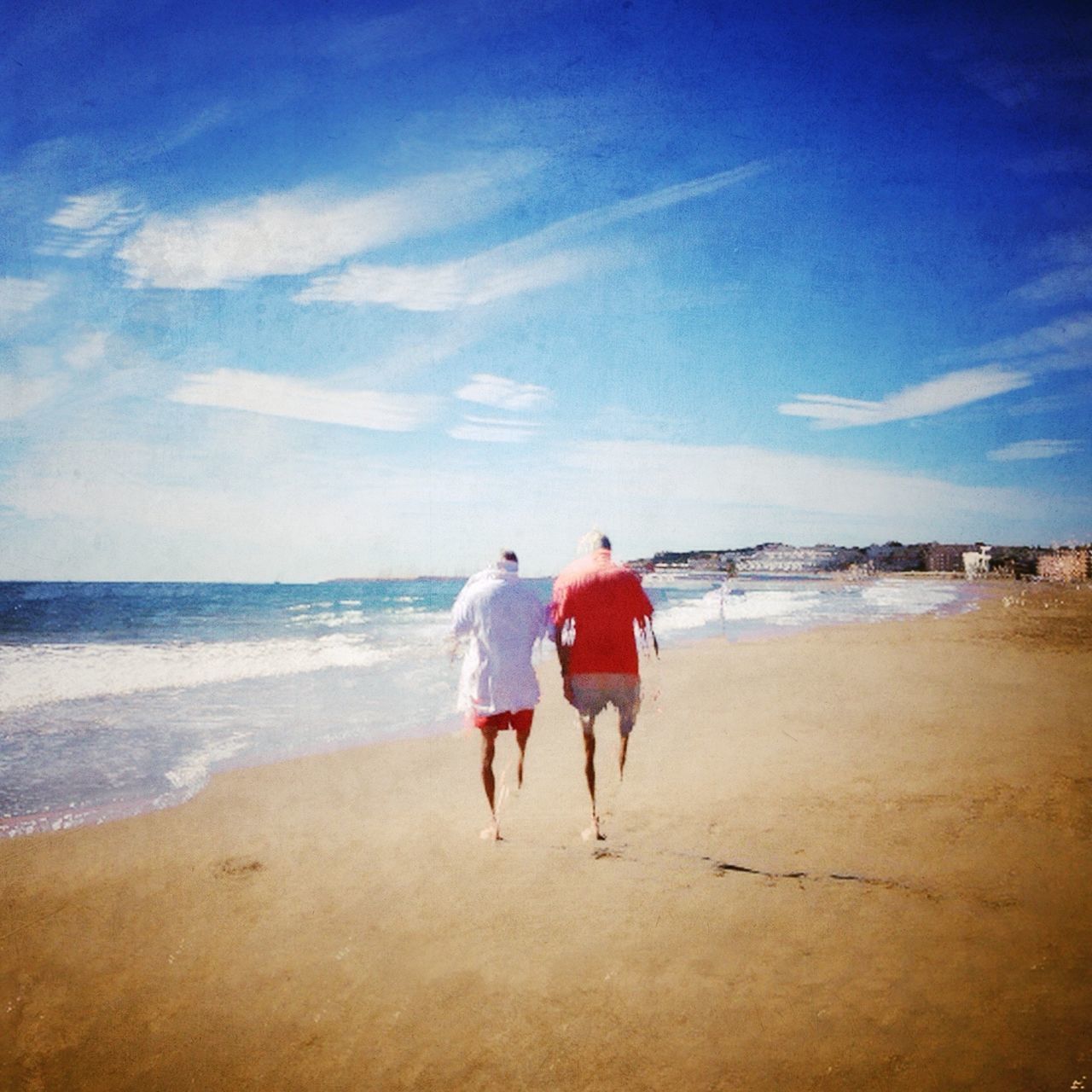 beach, sea, water, lifestyles, horizon over water, leisure activity, sand, shore, full length, sky, togetherness, rear view, vacations, bonding, walking, childhood, person, boys