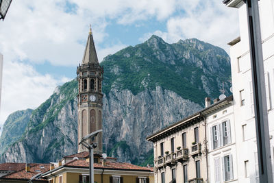 Panoramic view of building and mountains against sky