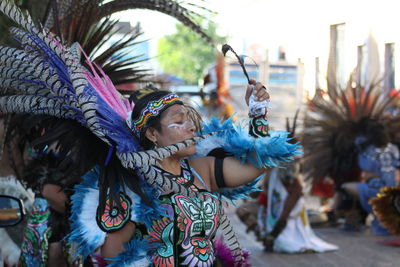 Feathers in traditional clothing during festival