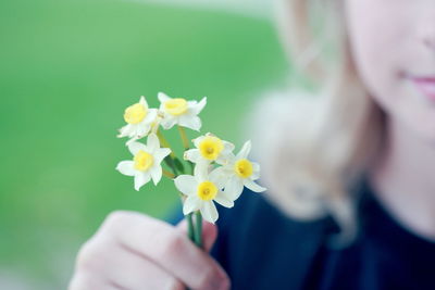 Close-up of girl holding flowers