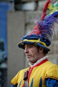 Close-up of man with yellow umbrella