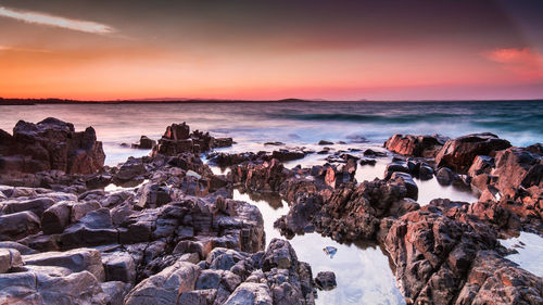 Panoramic view of sea against sky at sunset