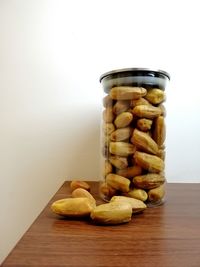 Close-up of bread in glass jar on table