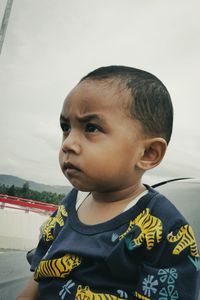 Portrait of cute boy looking away