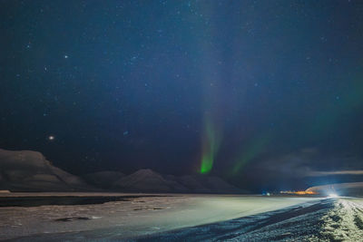 Scenic view of sea against sky at night