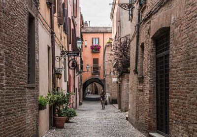 Narrow alley amidst buildings in town