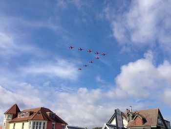 Low angle view of airplane flying in sky