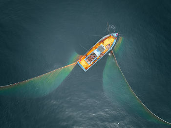 High angle view of ship sailing in sea